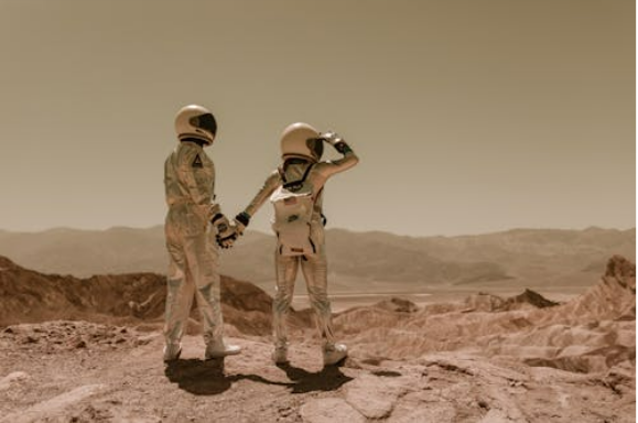 Two people wearing helmets standing on a rocky surface</p>
<p>AI-generated content may be incorrect.